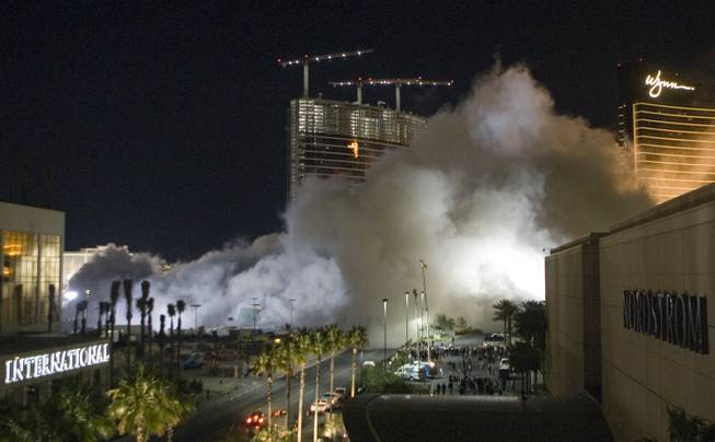 Dust from the implosion of the New Frontier hotel tower drifts to the south in Las Vegas, Nevada November 13, 2007. The casino on The Las Vegas Strip was purchased by Elad properties, an Israeli-owned real estate investment group, for more than U.S. $1.2 billion in May 2007. Elad Group, which also owns the Plaza hotel in New York, and the IDB Group are expected to build a Plaza-themed, multi-billion dollar megaresort on the site. 